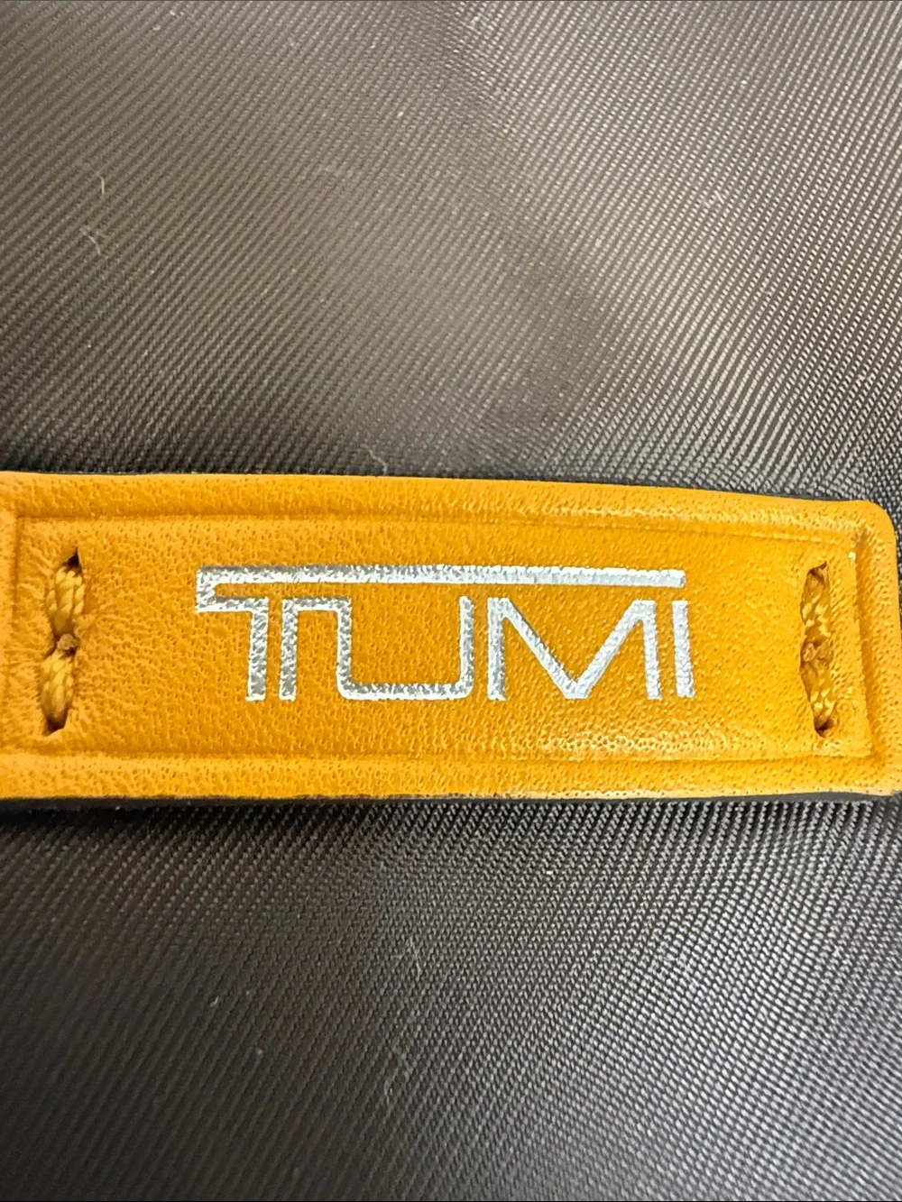 Tumi Brown Laptop Sleeve with Orange Logo Accent
